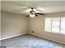 unfurnished room featuring ceiling fan