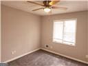 unfurnished room with ceiling fan