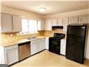 kitchen featuring extractor fan and black appliances