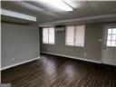 empty room with dark hardwood / wood-style floors