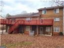 back of house featuring a deck