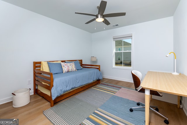 bedroom featuring ceiling fan and light hardwood / wood-style flooring