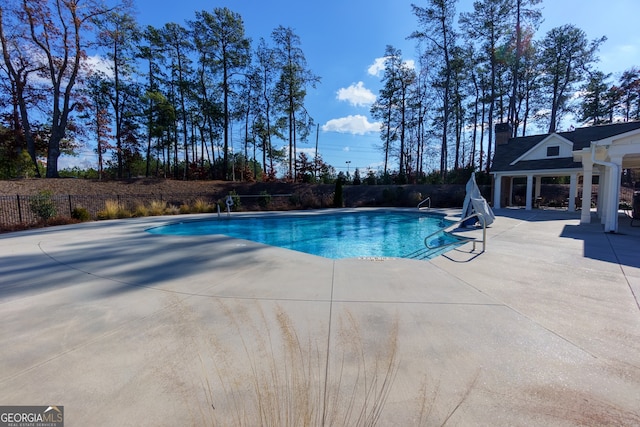 view of pool featuring a patio