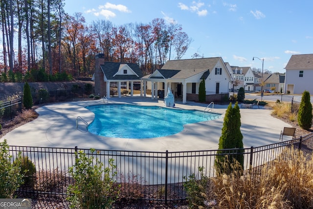 view of swimming pool featuring a patio area