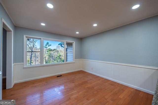 unfurnished room featuring light hardwood / wood-style flooring