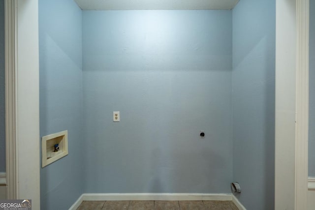 laundry area with light tile patterned floors, washer hookup, and hookup for an electric dryer