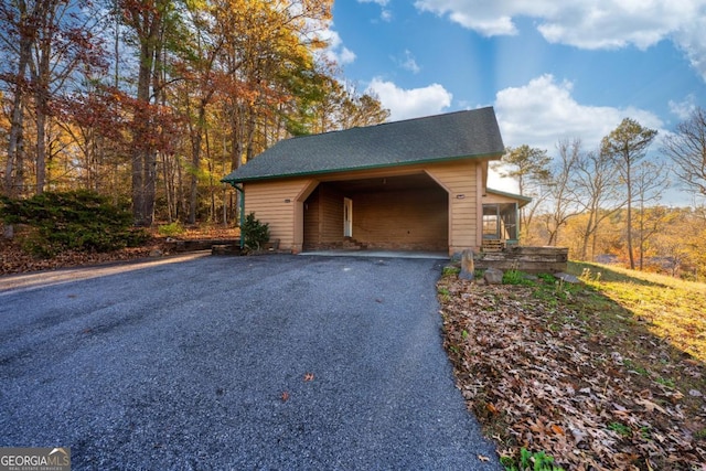 exterior space with a carport