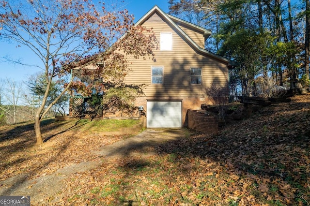 view of side of property featuring a garage