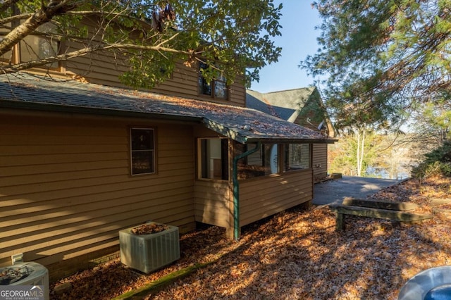 view of side of home featuring central air condition unit