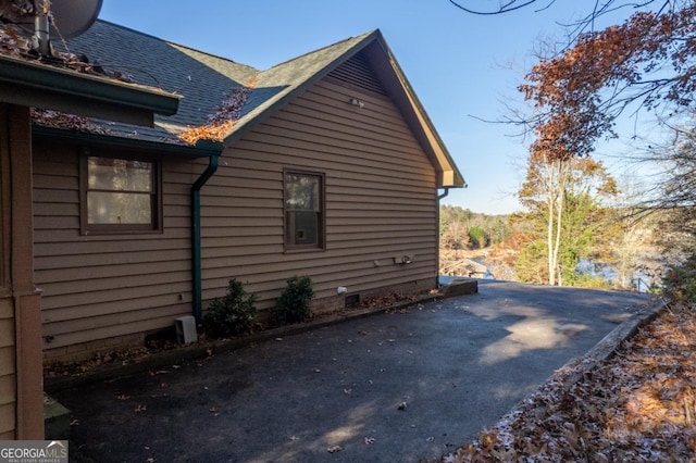 view of side of property with a patio area