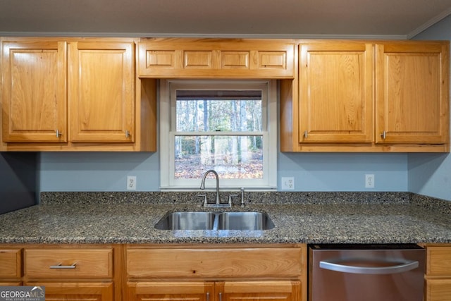 kitchen with dishwasher, ornamental molding, sink, and dark stone counters