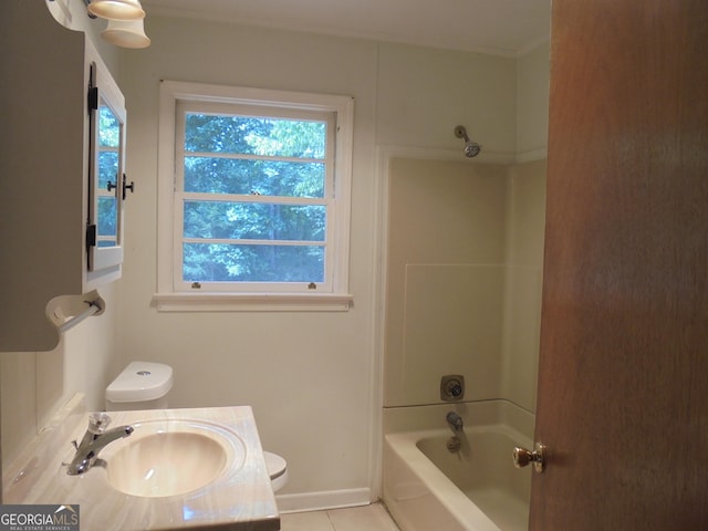 full bathroom with tile patterned floors, vanity, tub / shower combination, and toilet