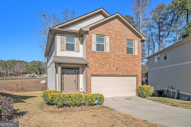 view of front of property with central AC, a front yard, and a garage