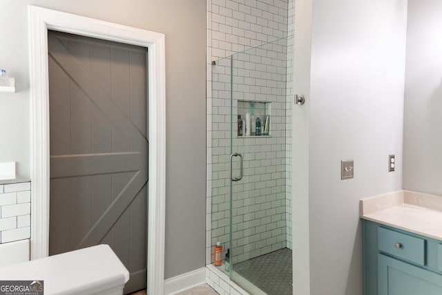 bathroom with vanity and a shower with door