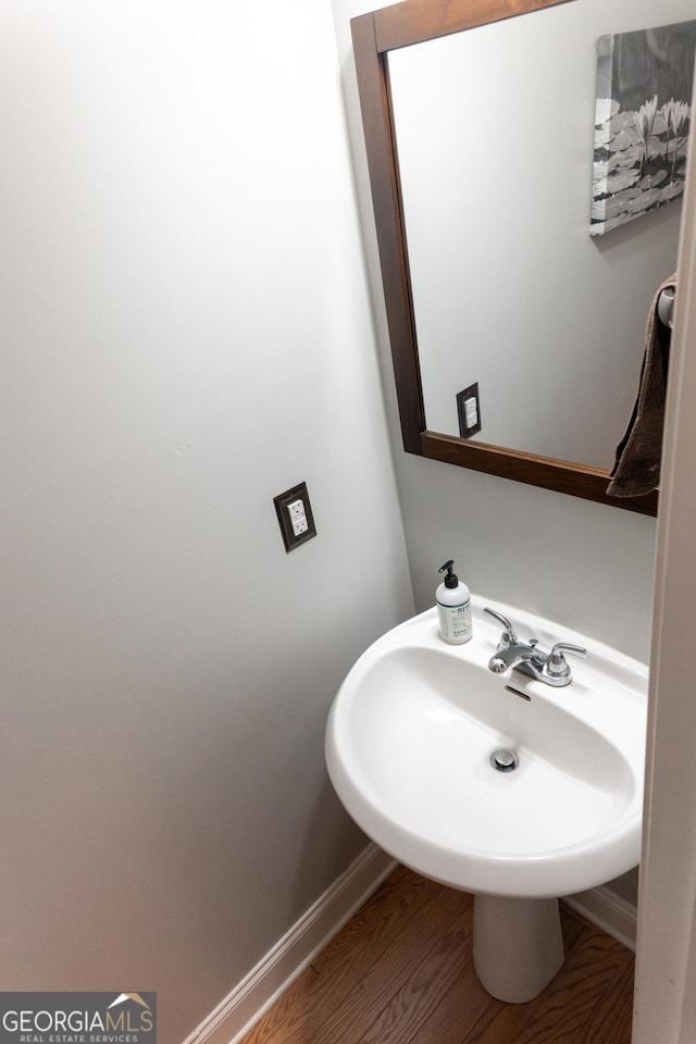 bathroom featuring sink and hardwood / wood-style flooring