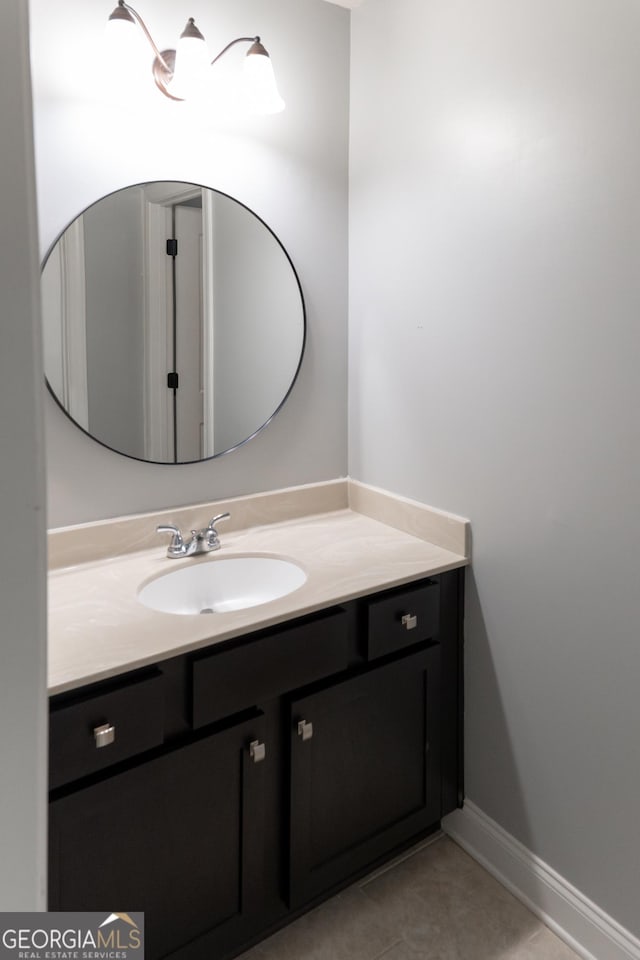 bathroom featuring tile patterned flooring and vanity