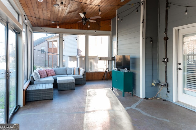 sunroom / solarium with ceiling fan, wooden ceiling, and vaulted ceiling