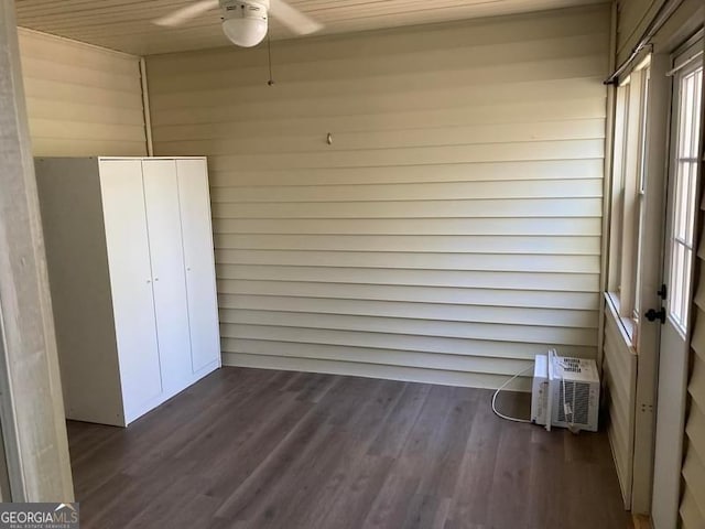 exterior space featuring ceiling fan, wooden ceiling, and a wall mounted air conditioner