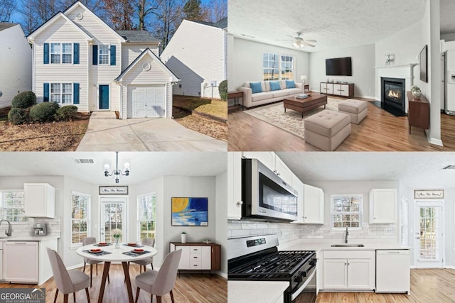 kitchen with white cabinets, appliances with stainless steel finishes, ceiling fan with notable chandelier, and light wood-type flooring