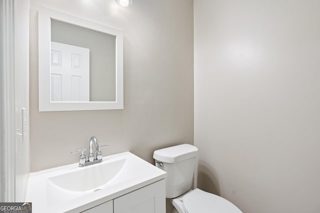 bathroom with vanity and toilet