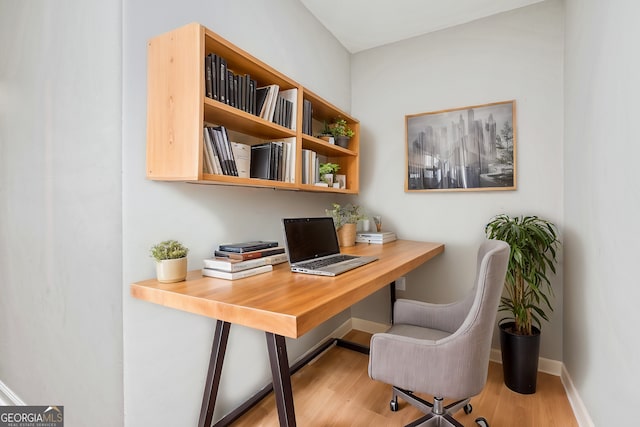 office space with light hardwood / wood-style flooring