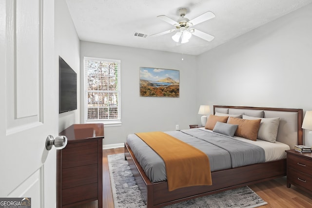 bedroom featuring ceiling fan and light wood-type flooring