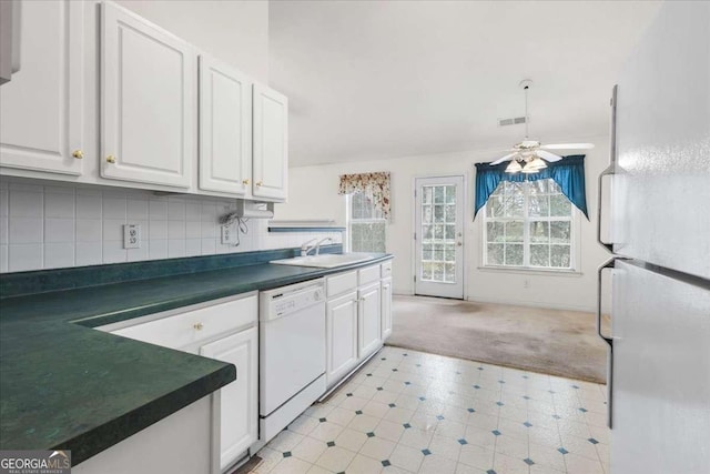 kitchen with ceiling fan, tasteful backsplash, white appliances, white cabinets, and sink