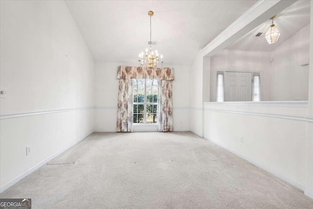 carpeted spare room with vaulted ceiling and an inviting chandelier