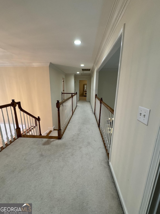 hallway featuring light carpet and crown molding