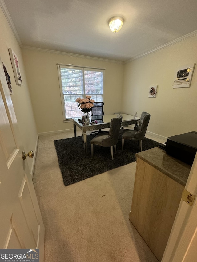 dining room featuring light carpet and ornamental molding