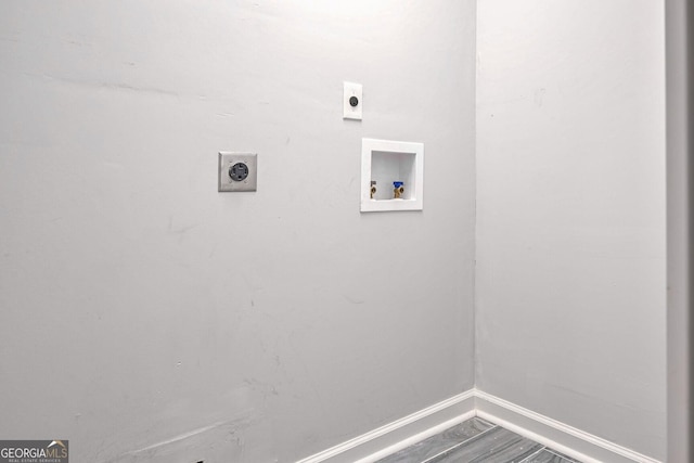 washroom featuring hardwood / wood-style floors, electric dryer hookup, and hookup for a washing machine