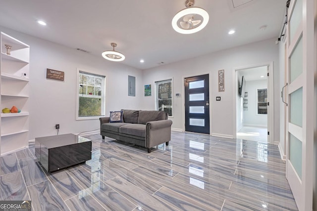 living room featuring a barn door