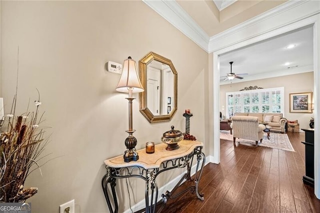 hall featuring dark hardwood / wood-style flooring and crown molding