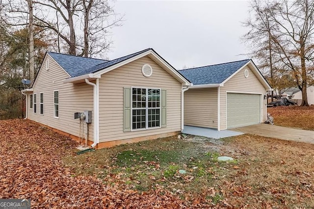 view of property exterior with a garage