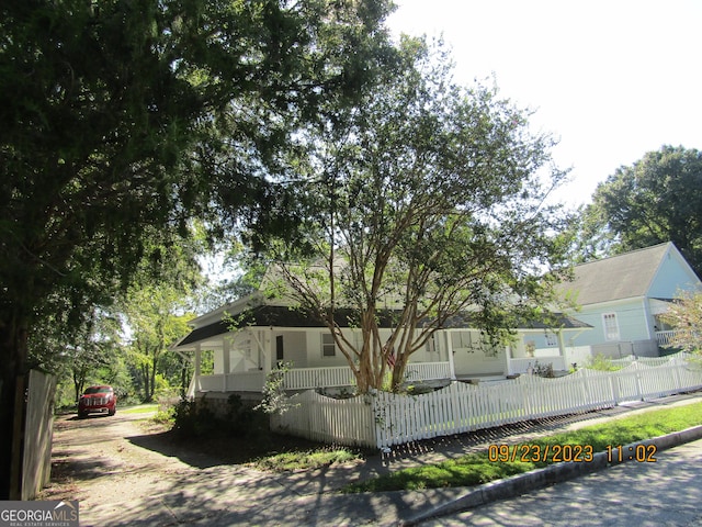 view of property exterior with covered porch