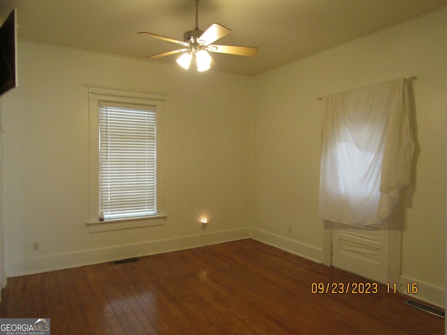 unfurnished room featuring ceiling fan and dark hardwood / wood-style floors