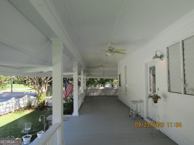 exterior space with ceiling fan