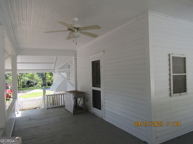 wooden deck with ceiling fan and covered porch