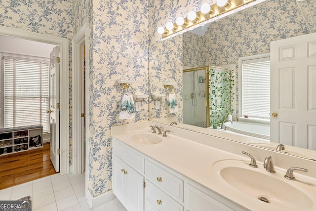 bathroom featuring vanity, tile patterned floors, and shower with separate bathtub