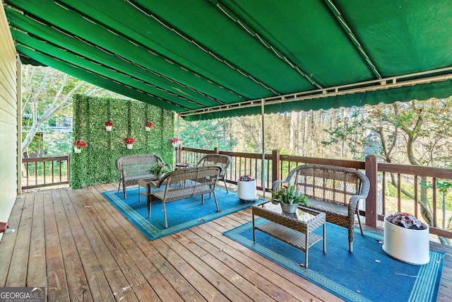 wooden deck with an outdoor hangout area