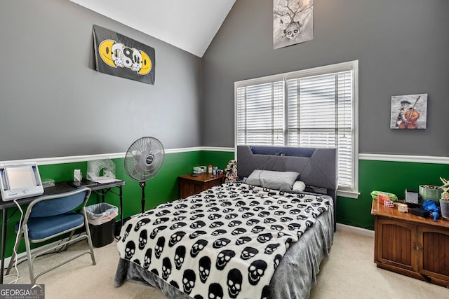 carpeted bedroom with lofted ceiling