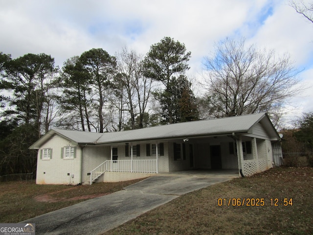 single story home with a carport and covered porch