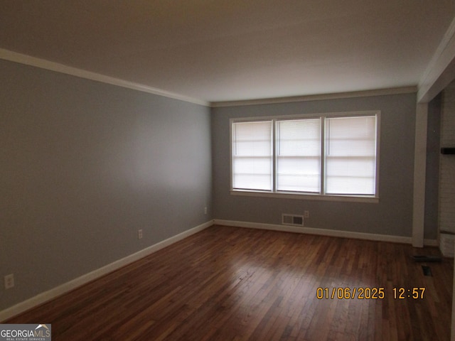 unfurnished room featuring dark hardwood / wood-style floors and crown molding