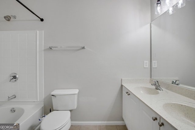 bathroom with double vanity, toilet, shower / bathtub combination, and a sink