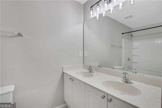 full bathroom with shower / bathing tub combination, vanity, and toilet