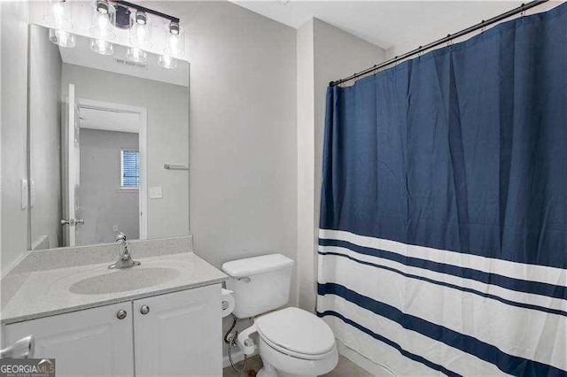 bathroom with vanity and toilet