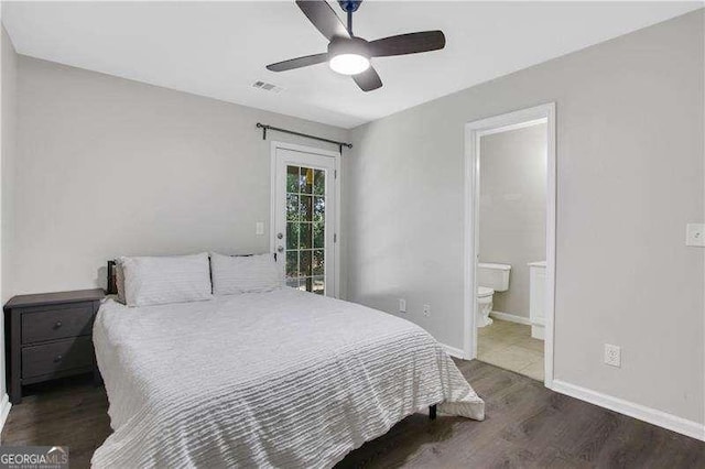 bedroom with ceiling fan, dark hardwood / wood-style flooring, and ensuite bathroom