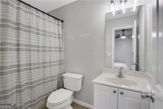 bathroom with ceiling fan, toilet, and vanity