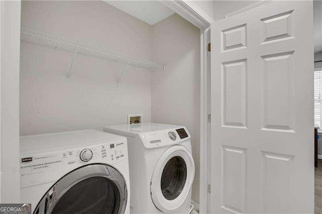 laundry room featuring independent washer and dryer