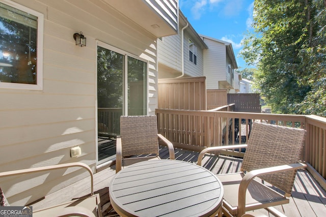 wooden deck with outdoor dining area